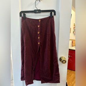 Unworn size M long burgundy skirt with buttons in front